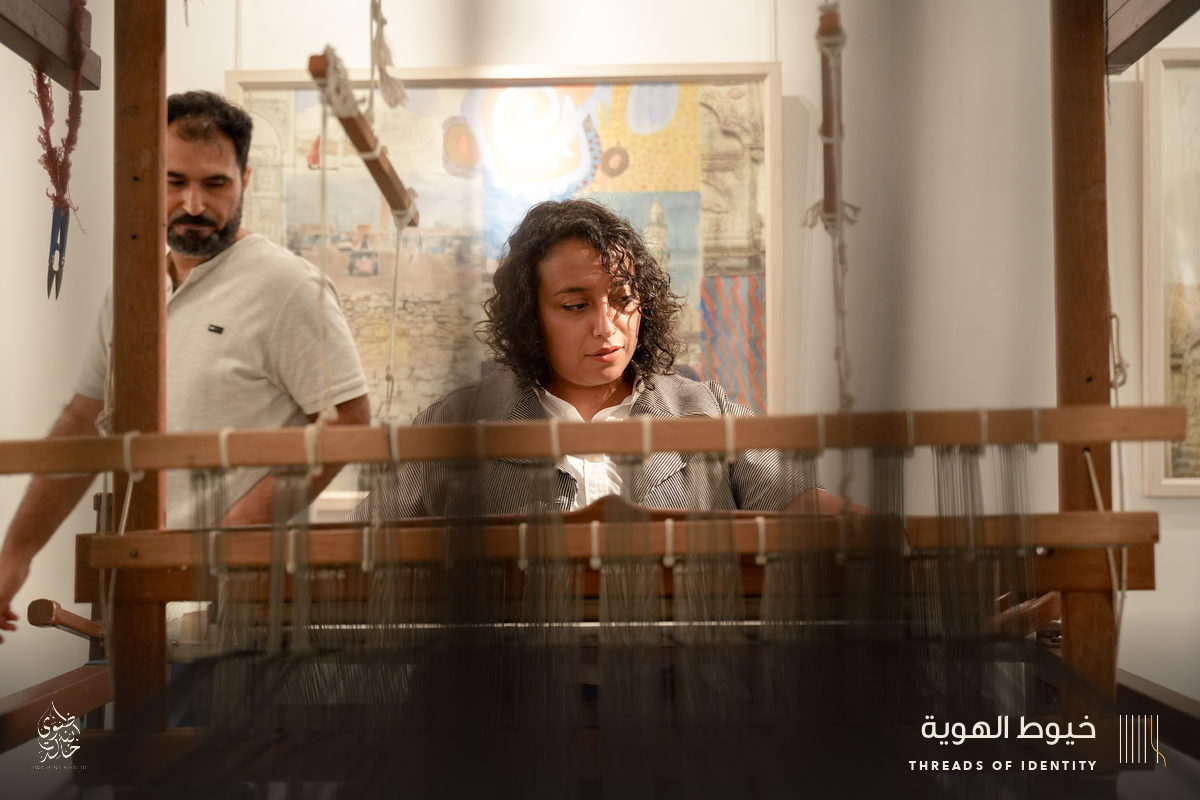 Marie Joubert and Tamadher AlFahal at the loom