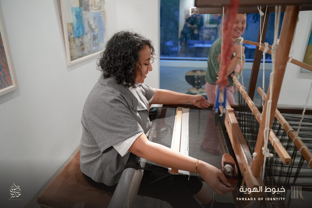 Marie Joubert and Tamadher AlFahal at the loom