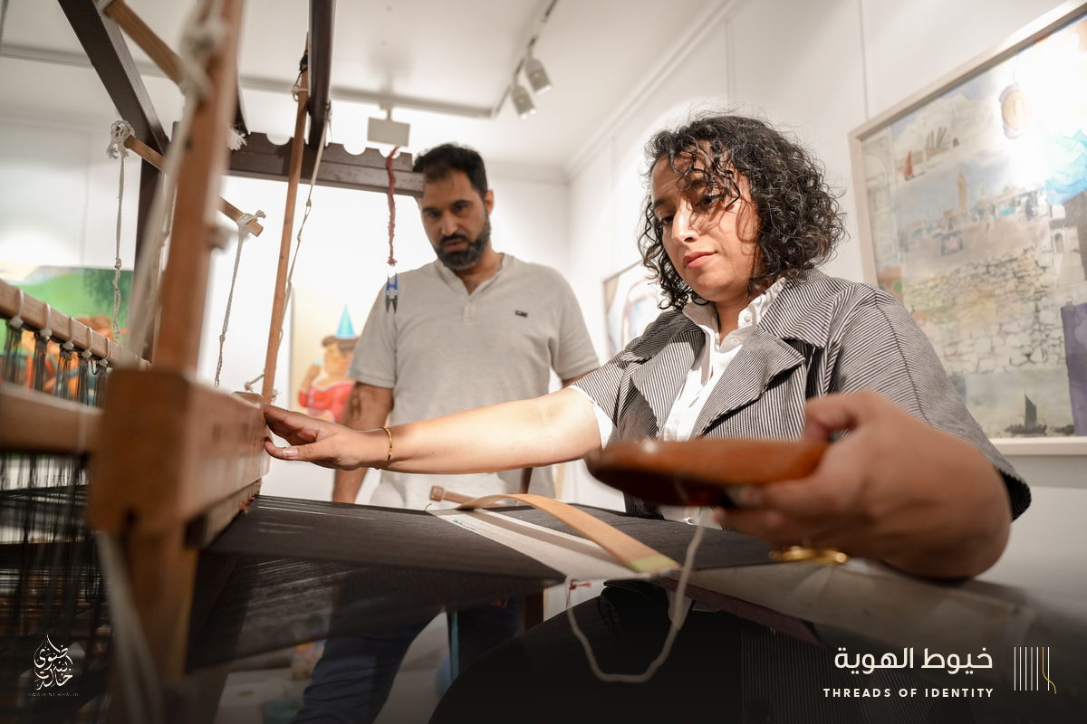 Marie Joubert and Tamadher AlFahal at the loom