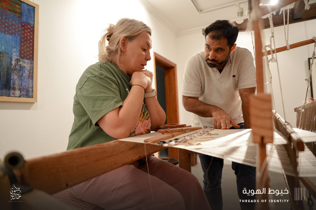 Marie Joubert and Tamadher AlFahal at the loom