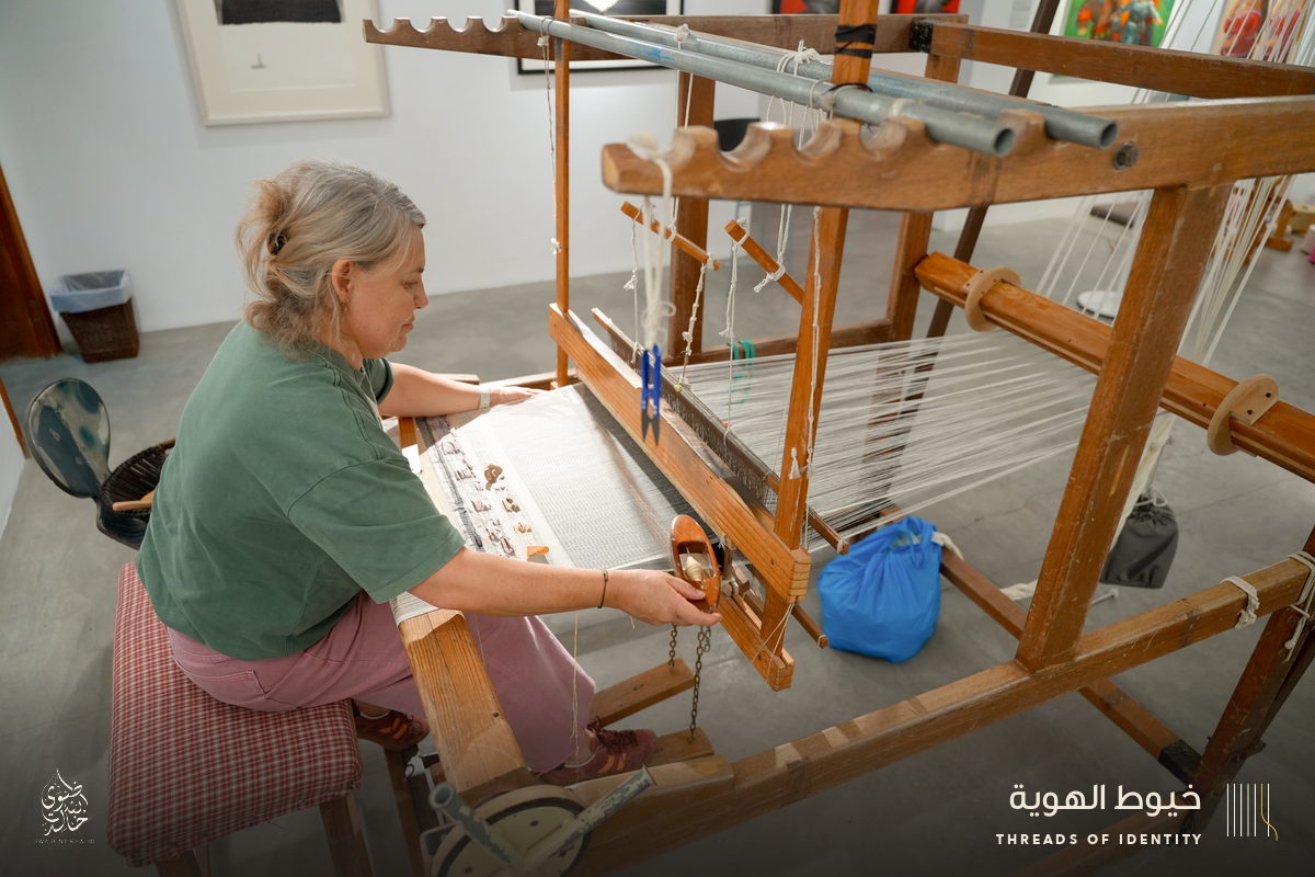 Marie Joubert and Tamadher AlFahal at the loom
